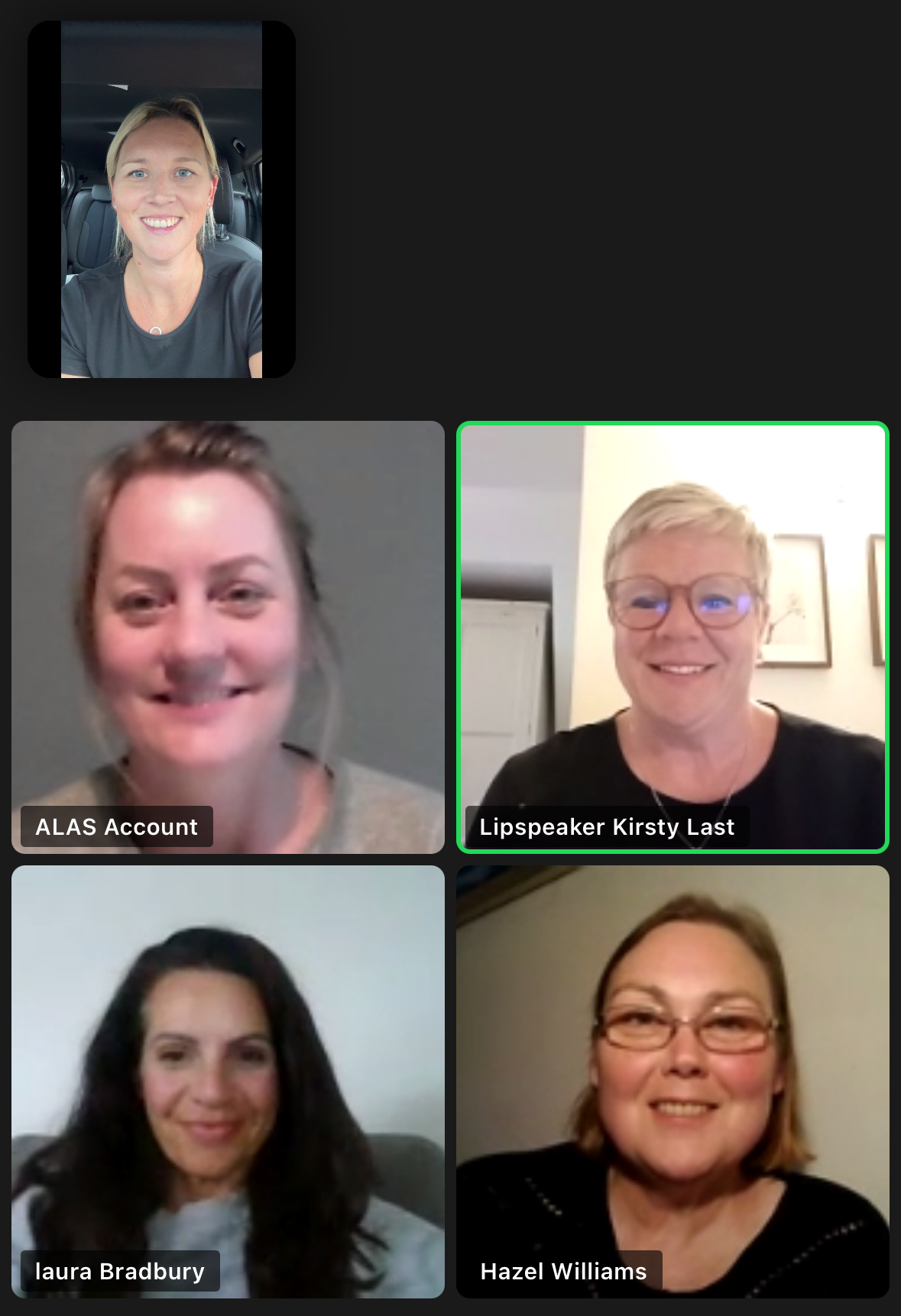 Five women visible on a computer screen. All women are visibly smiling and posing for the photograph.